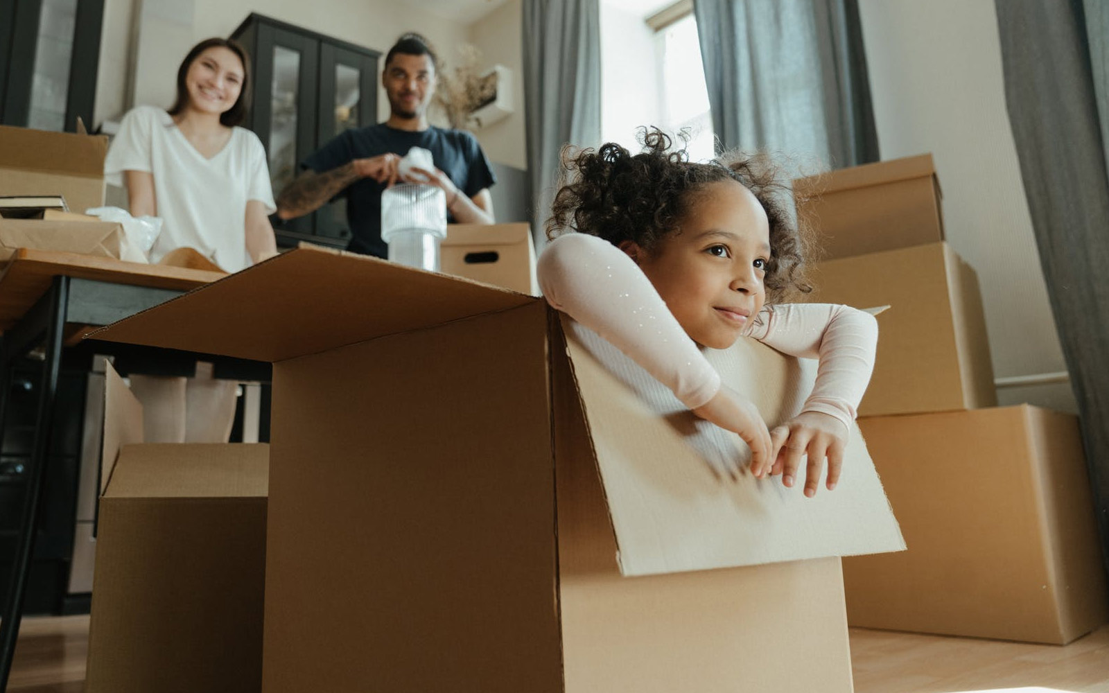 Young girl playing in box